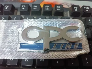 OPC LINE metalni amblem - nalepnica znak za gepek blatobran