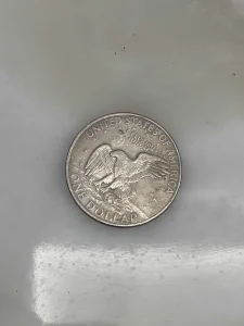 Metalna kovanica jedan dolar iz 1977 godine