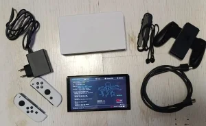 Nintendo Switch OLED SD 256GB/Cipovan/ 50 igara /Torbica