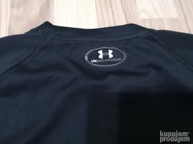 8143 - UNDER ARMOUR majica L/XL Org TOP